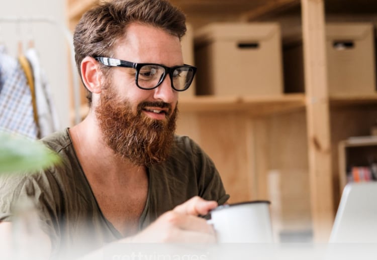 Man having coofee indoors.