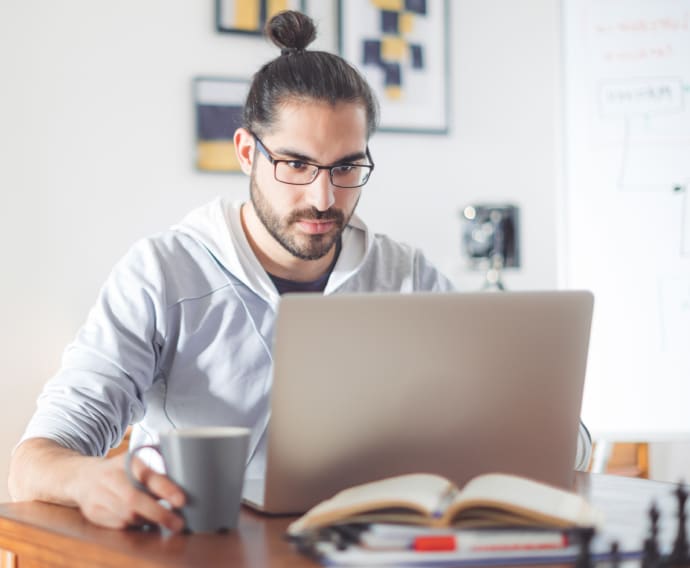 Young man working at home.